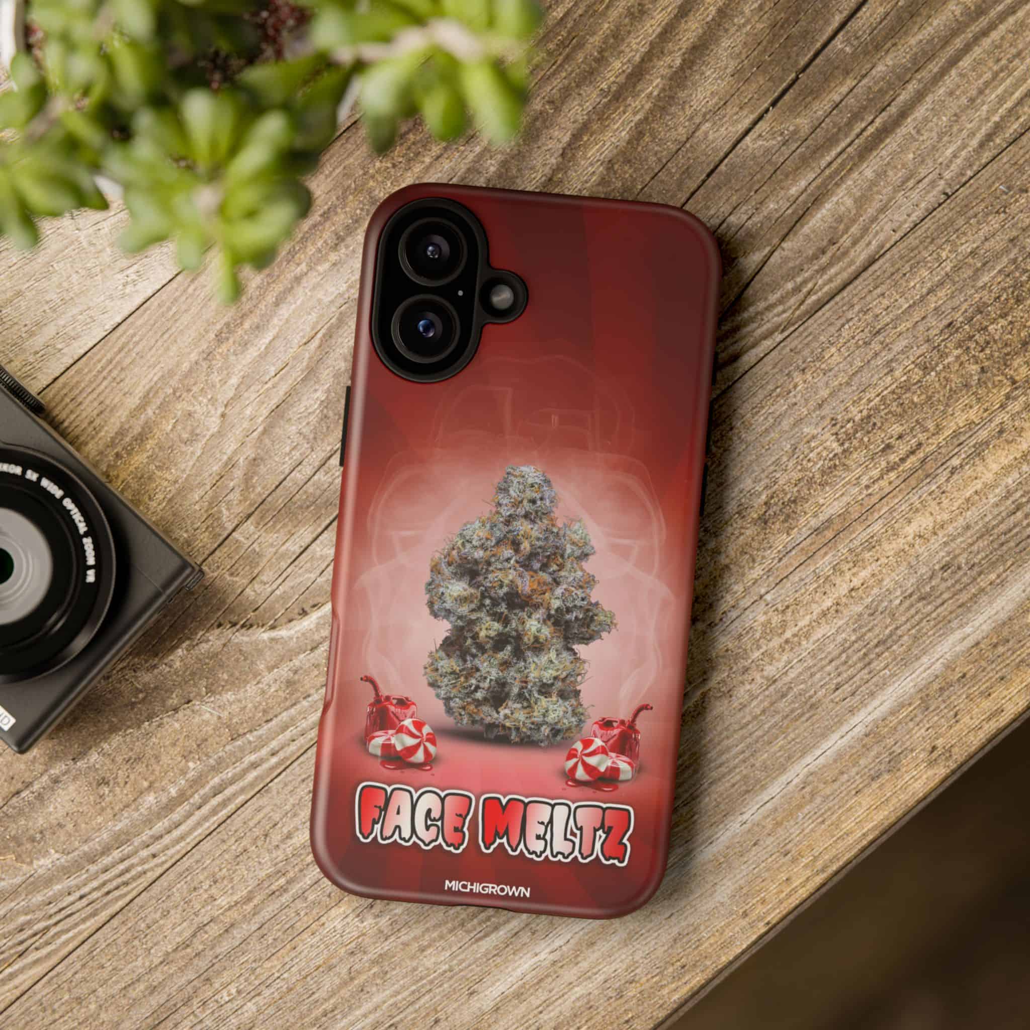Custom Face Meltz cannabis-themed phone case with marijuana bud design.