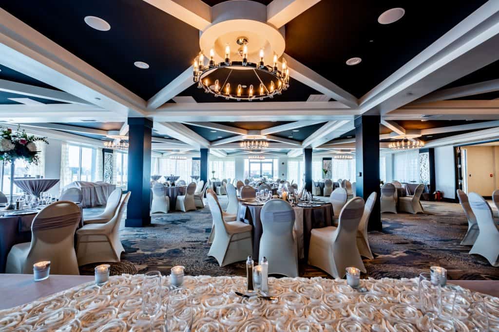 Spacious private event space with elegant decor and lighting at Mudpenny.