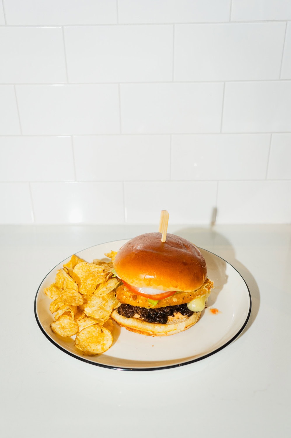 Curd Burger with beef patty, cheese curds, and burger toppings.