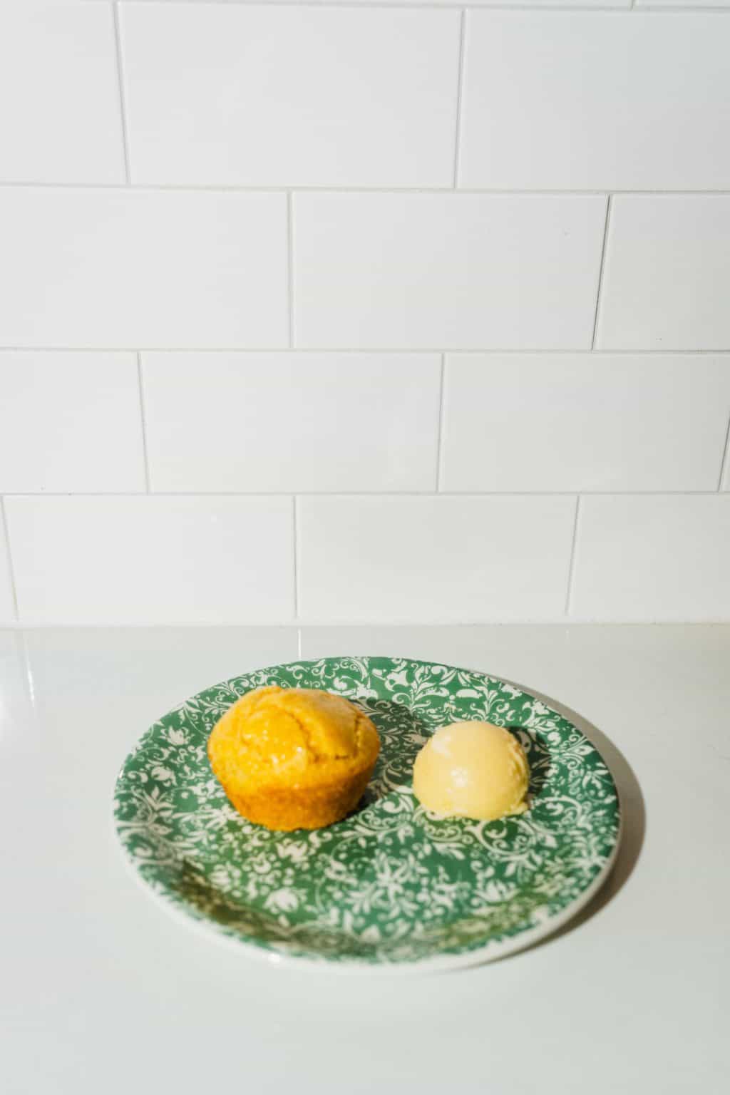 Cornbread muffin served with butter.