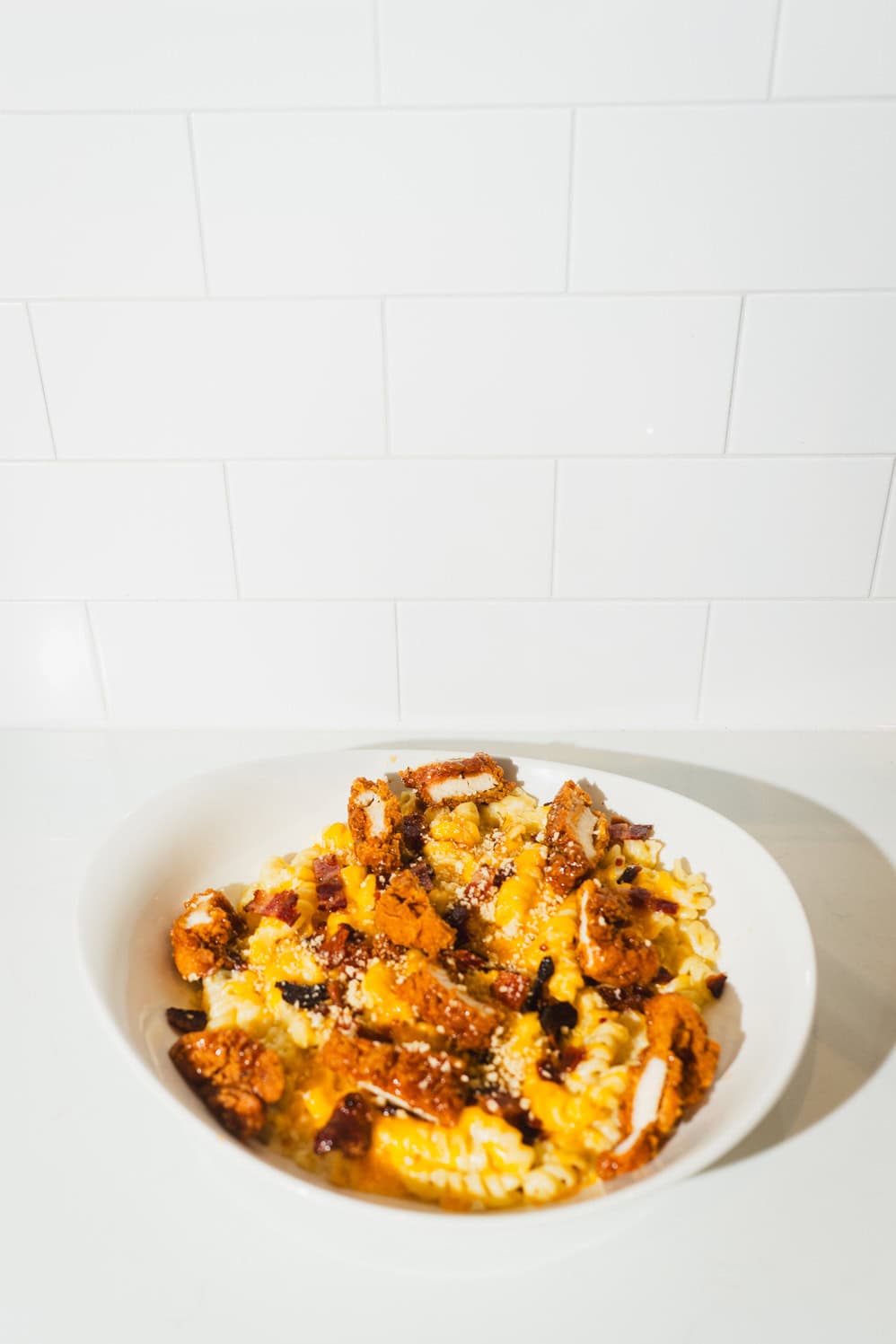 Creamy macaroni and cheese in a serving bowl.