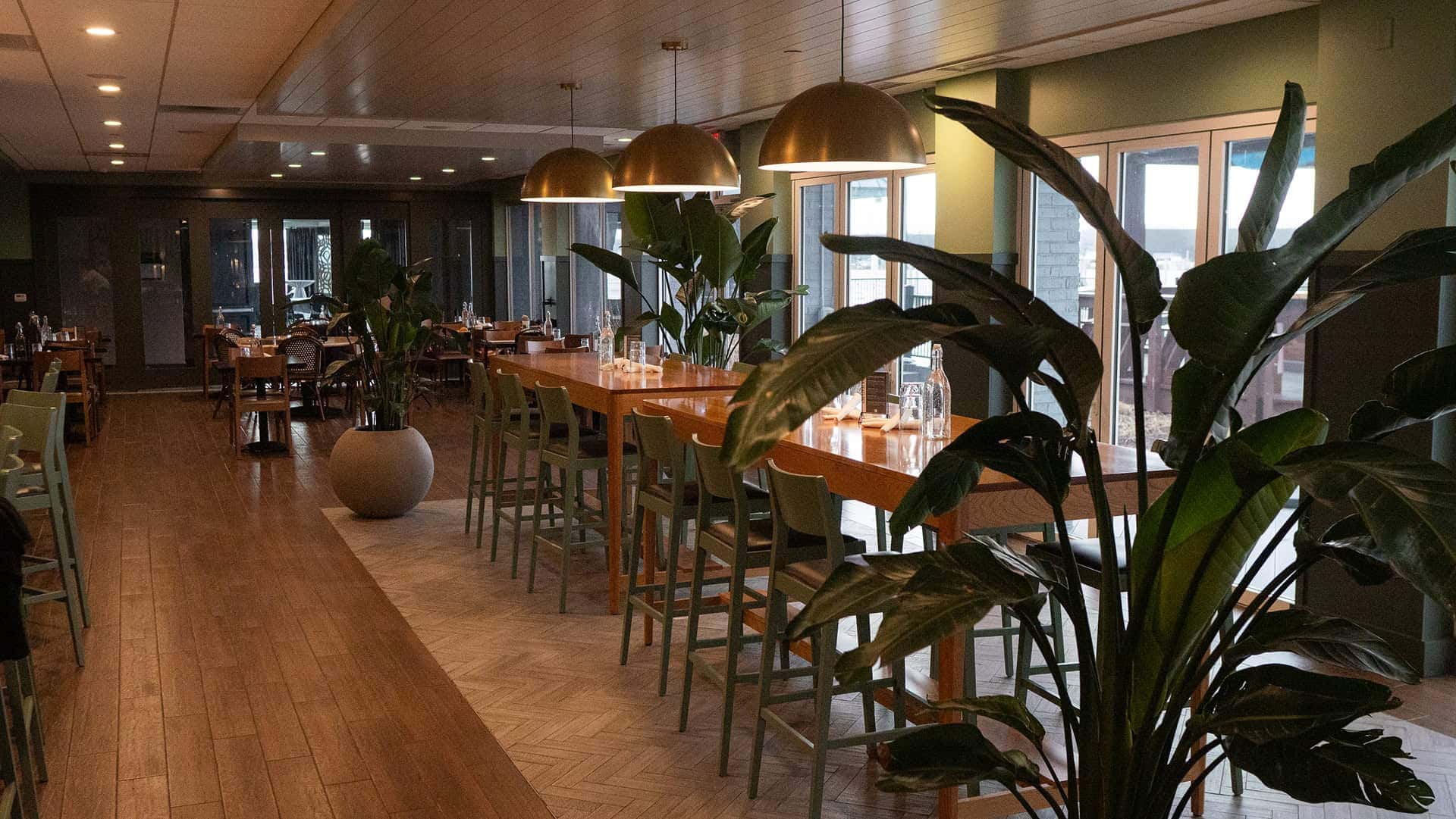 Private event area with modern decor and natural lighting at Mudpenny. Perfect for gatherings and ce.