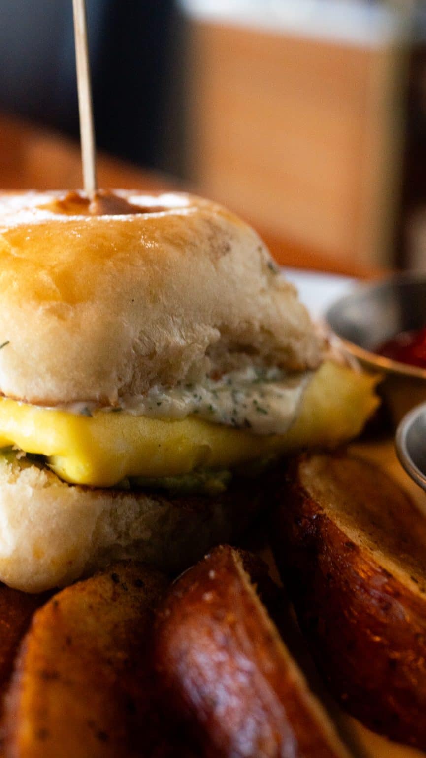Delicious egg sandwich served with crispy roasted potatoes at Spring Lake.