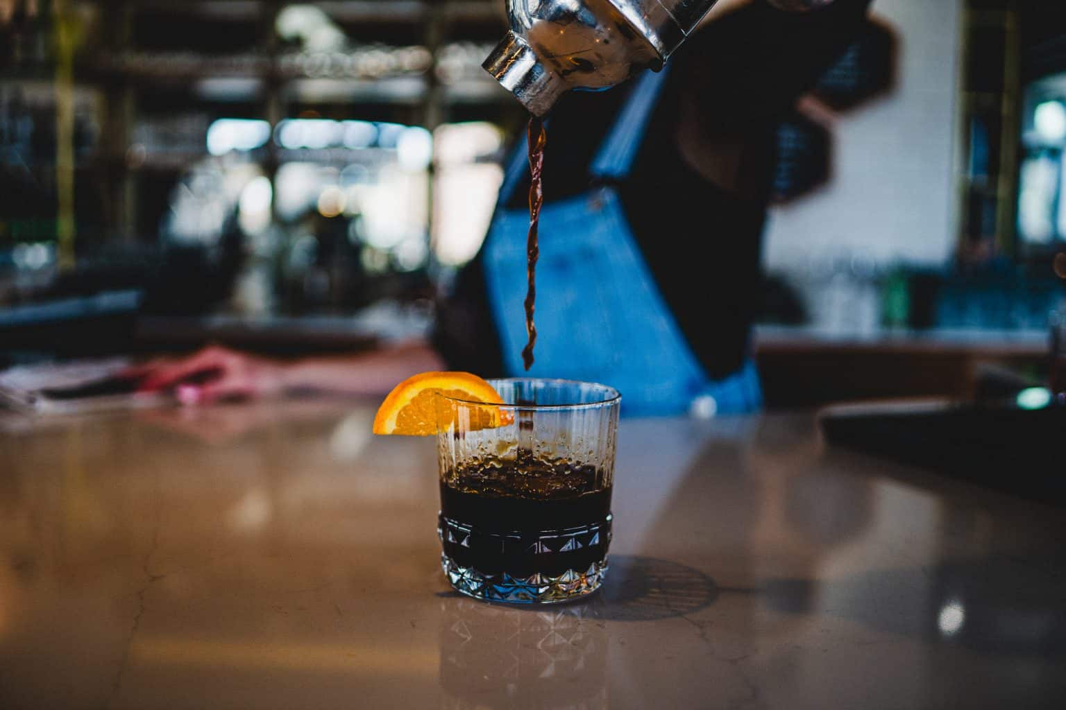Refreshing cold brew coffee with orange garnish at Spring Lake.