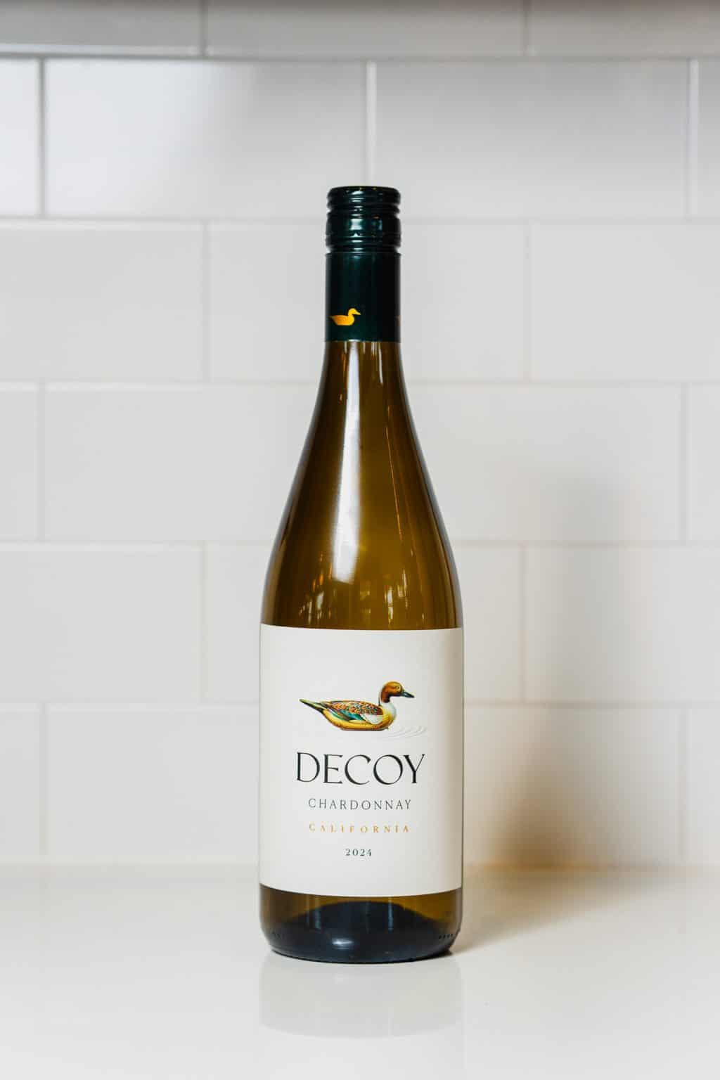 Decoy Chardonnay 2024 wine bottle on white kitchen counter.