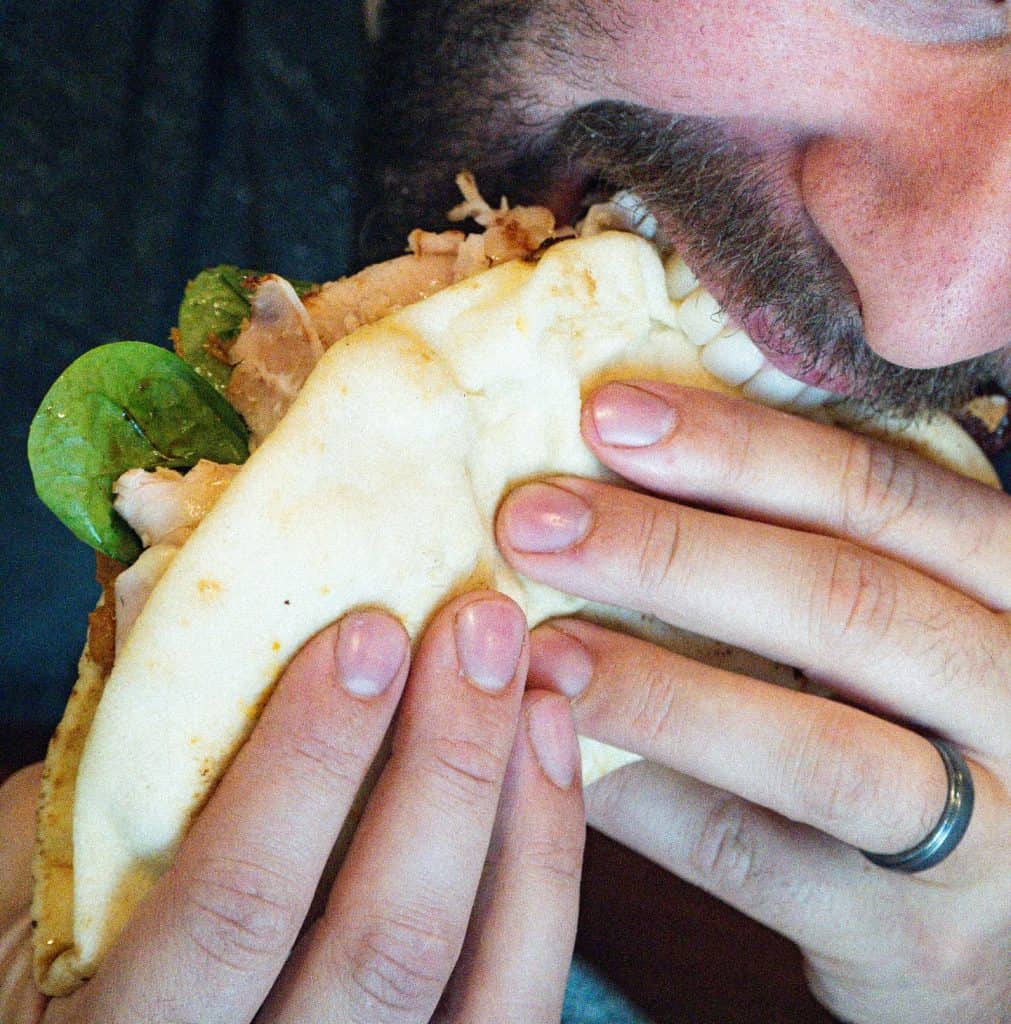 Tasty taco with meat, lettuce, and cheese, perfect for a quick meal or snack.