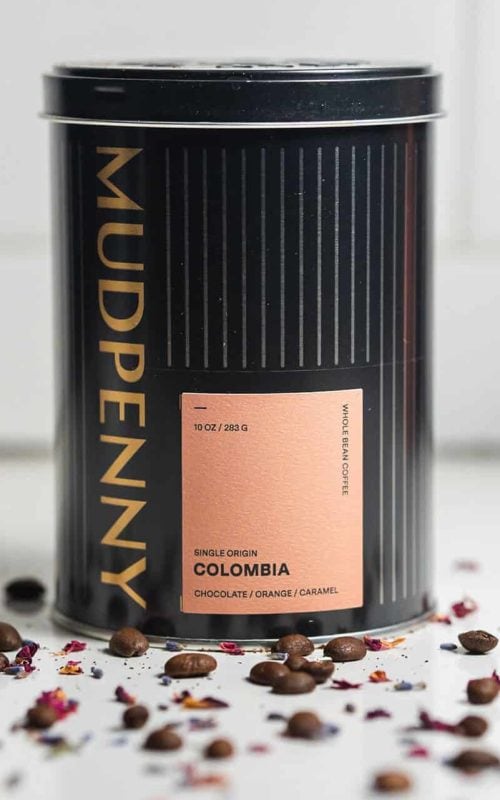 Mudpenny Colombia chocolate orange scented candle in black tin container.