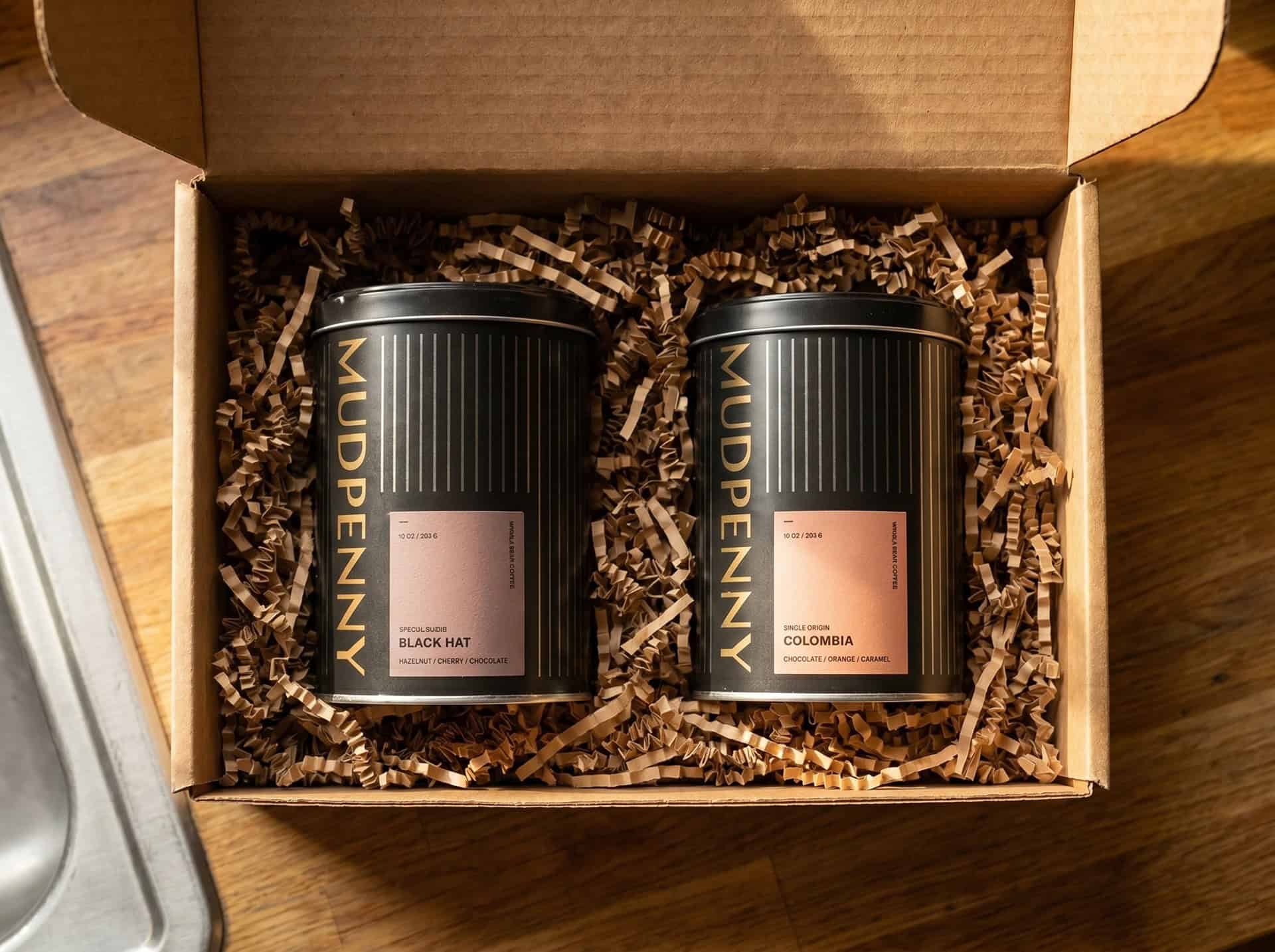 Mudpenny coffee tins with Black Hat and Colombia blends in gift box.
