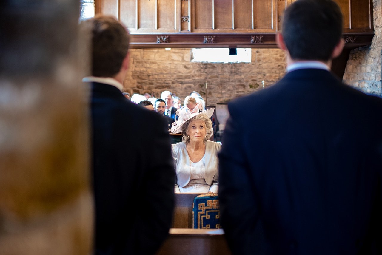 Dorset church wedding ceremony photograph mother bride looking up towards god from wedding photographers portfolio