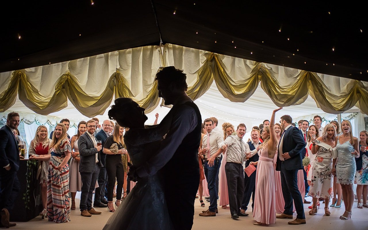 Secret first dance reveal guests reactions marquee wedding
