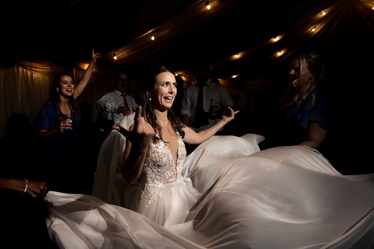 Wedding dancing photograph brides dress fanned out marquee dancefloor