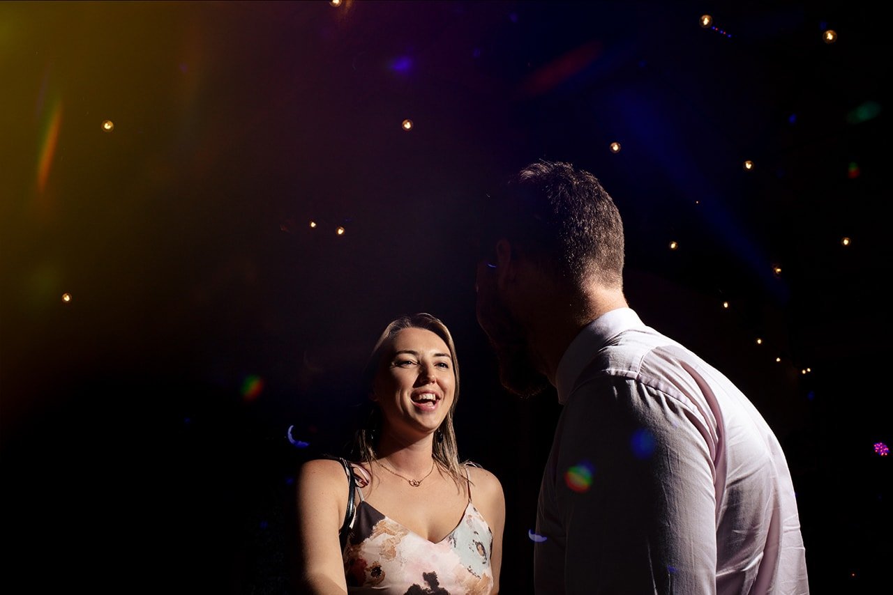 dorset wedding photographer gallery example wedding guests under disco lights dancefloor