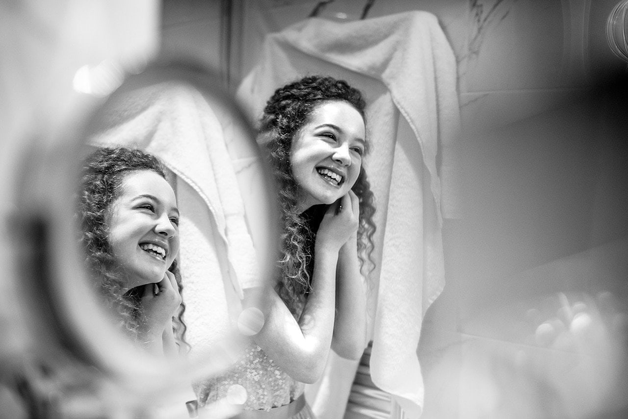 portrait photograph bridesmaid captured Careys Manor hotel mirrors wedding morning black white photo