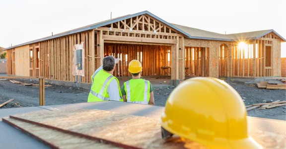 contruction crew outside of new home build