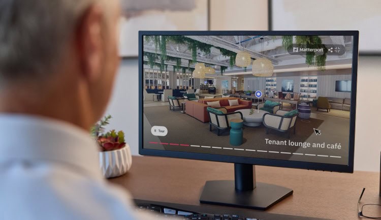 office workering looking at office space digital twin