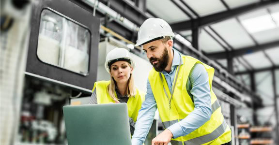two engineers working on laptop