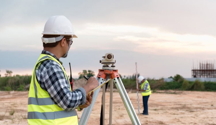 two workers conducting a site survey