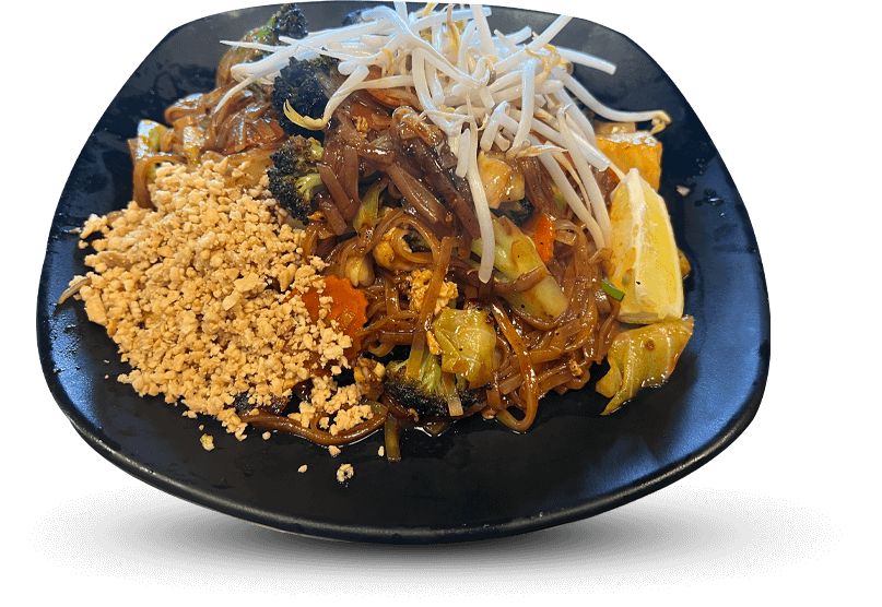 A Thai dish featuring rice noodles stir-fried with curry sauce, egg, fresh vegetables, and aromatic herbs for a comforting, flavorful meal.