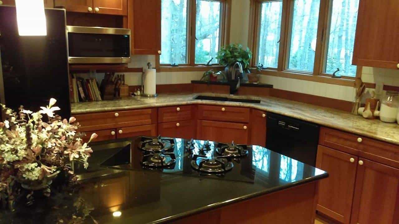 Kitchen with granite countertops and wooden cabinets.