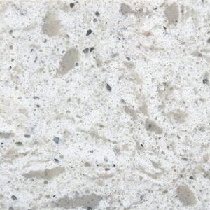 Remnants 4 Close-up of beige granite with black and gray mineral specks.