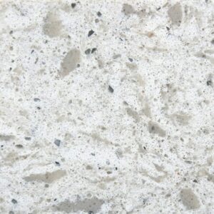 Remnants 3 Close-up of light-colored granite with black and gray specks.