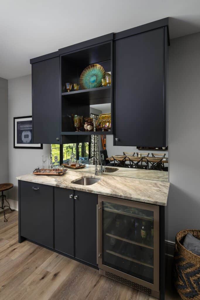 Modern Kitchen with Dark Cabinets and Marble Counn