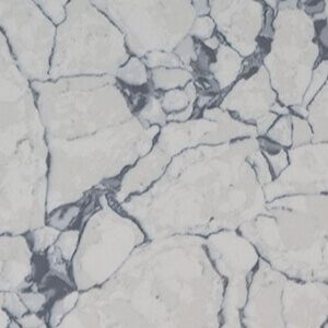 Close-up of white marble granite with gray veining and cracks.