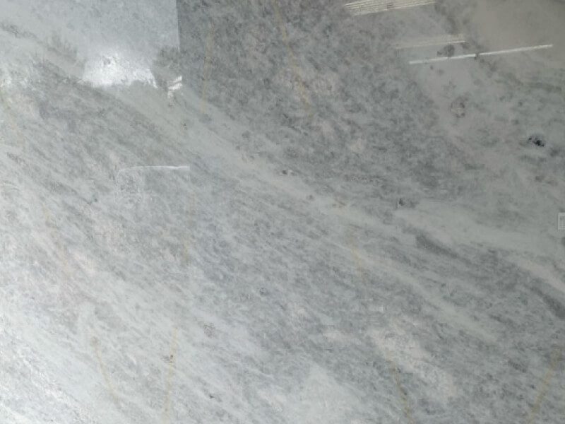 Dolomite 2 Close-up of Dolomite granite with natural gray and white veining.