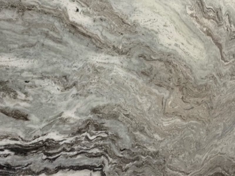 Dolomite 3 Close-up of Dolomite stone with beige and gray swirling patterns.