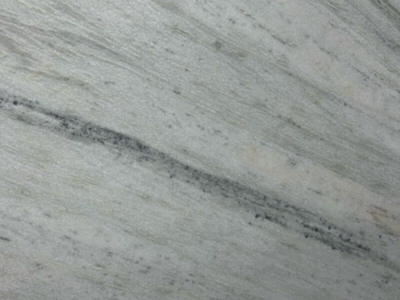 Dolomite 5 Close-up of gray granite slab with natural veining and texture.