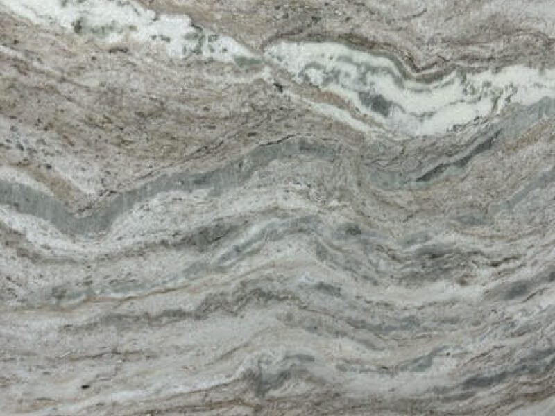 Dolomite 7 Close-up of a granite countertop with gray, white, and beige veining.