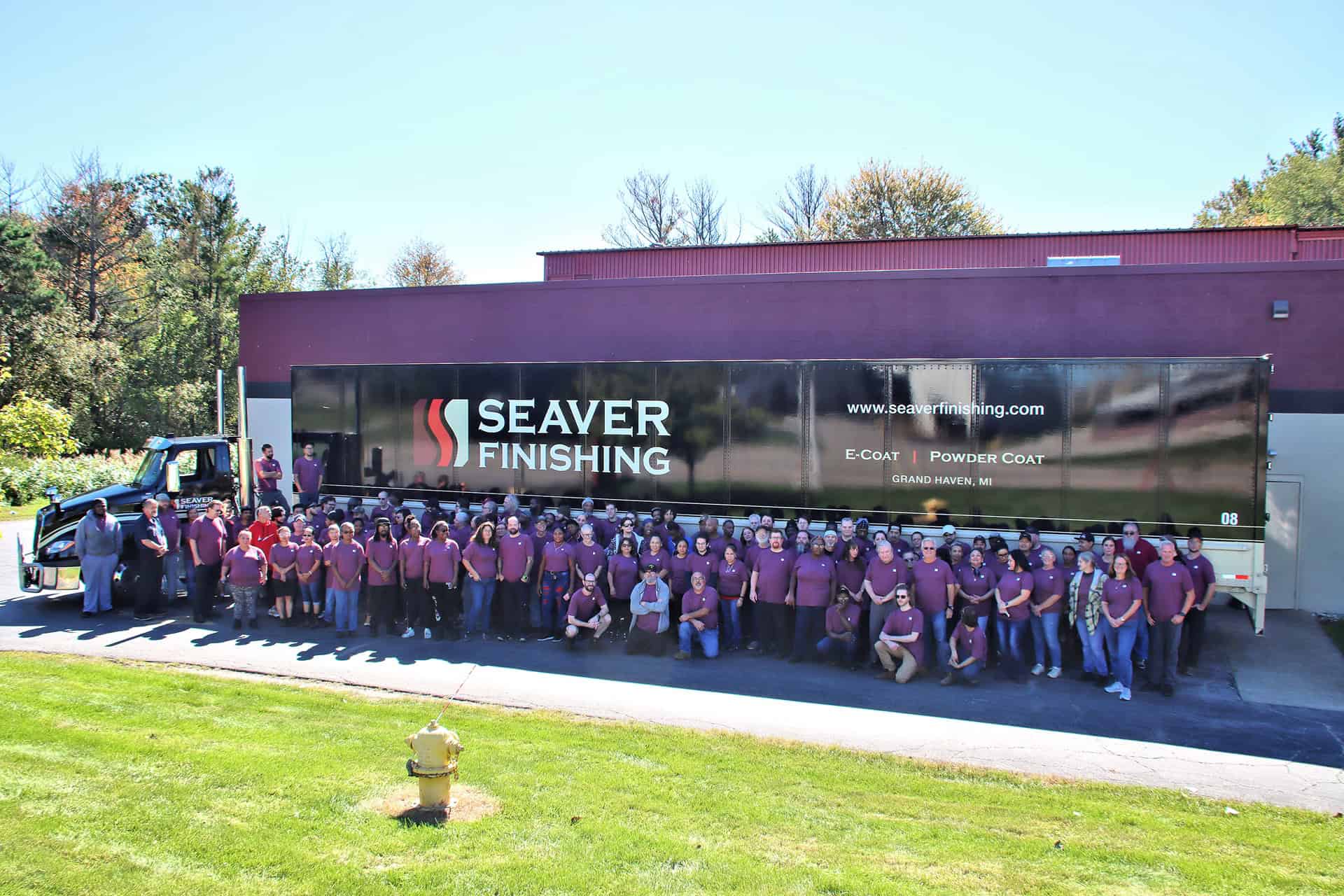 Group photo of Seaver Finishing team outside their truck.