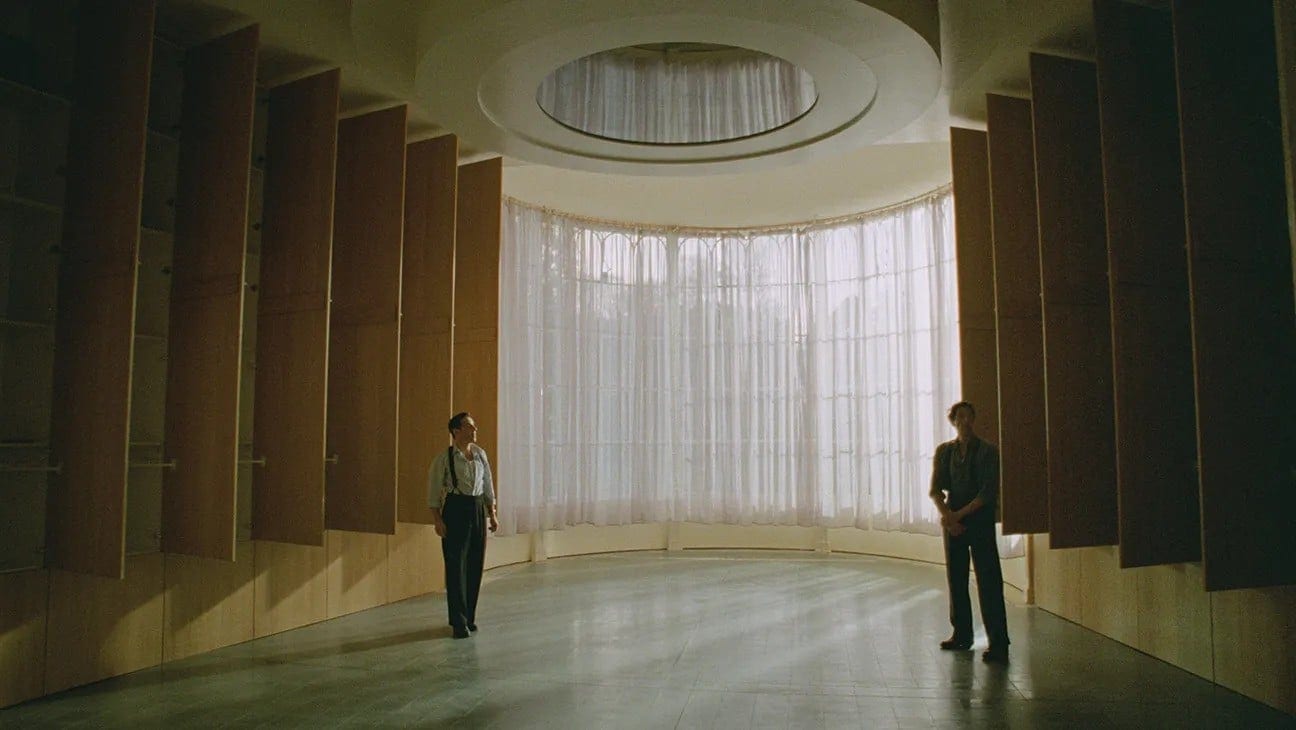 Alessandro Nivola and Adrien Brody in The Brutalist