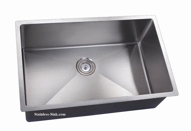 Stainless steel kitchen sink with single basin and drain in a modern kitchen.