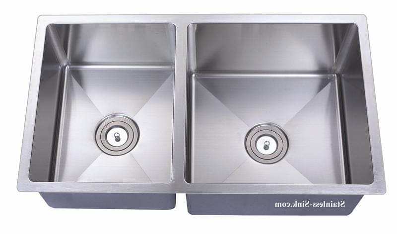 Stainless steel double kitchen sink with two basins and drain openings.