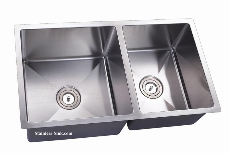 Stainless steel double kitchen sink with two basins and modern design.