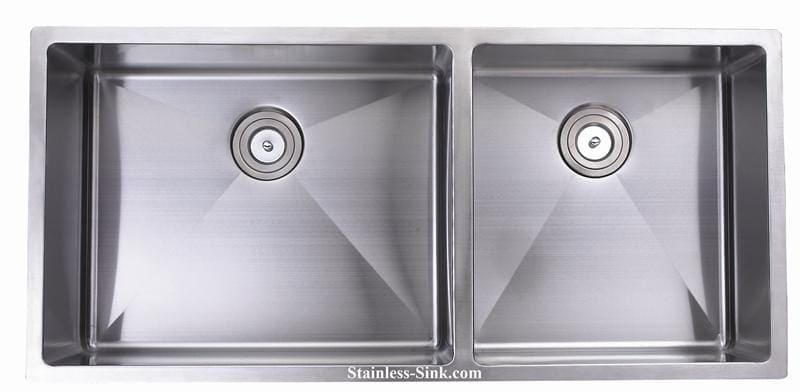 Double stainless steel kitchen sink with two basins and drain openings.