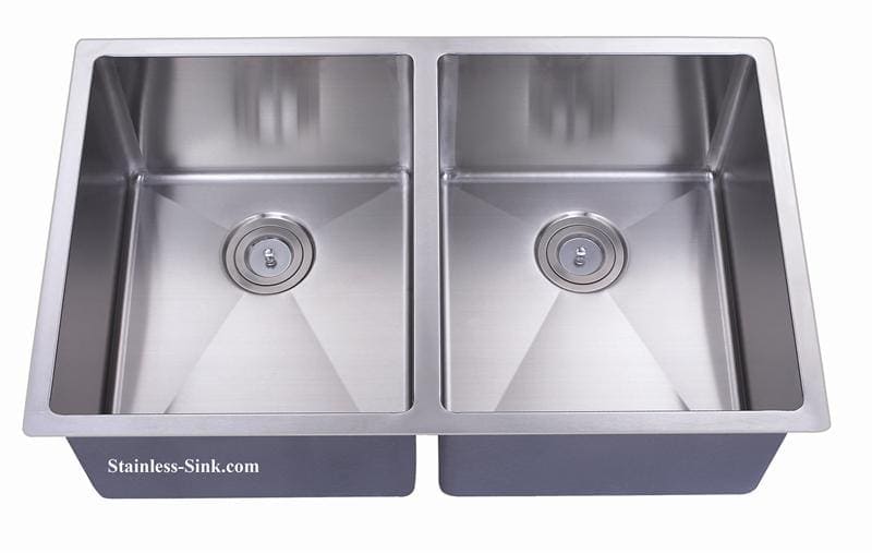 Stainless steel double kitchen sink with two basins and drain openings.