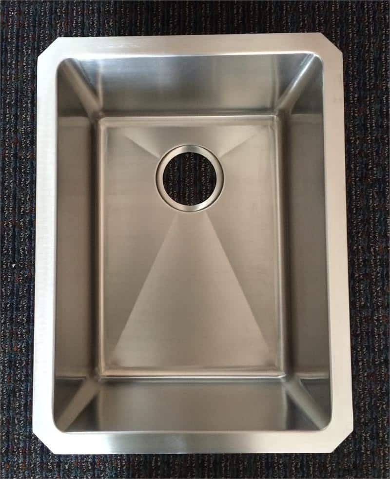 Stainless steel single bowl undermount sink with near zero radius edges. Perfect for modern kitchens.