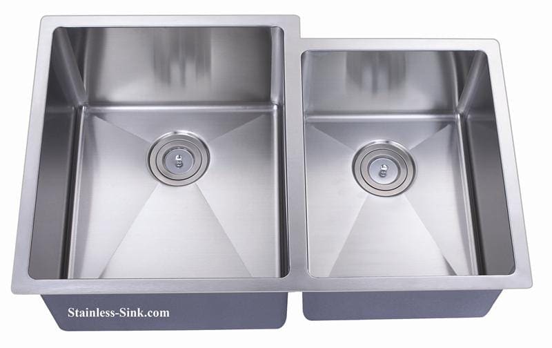 Stainless steel double kitchen sink with two basins and drain openings.