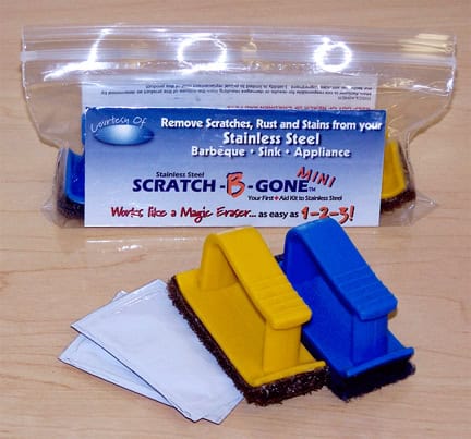 Stainless steel sink scratch and rust remover kit with scrub pads and cleaning cloths.