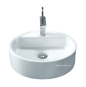 White ceramic bathroom sink with chrome faucet and drain.