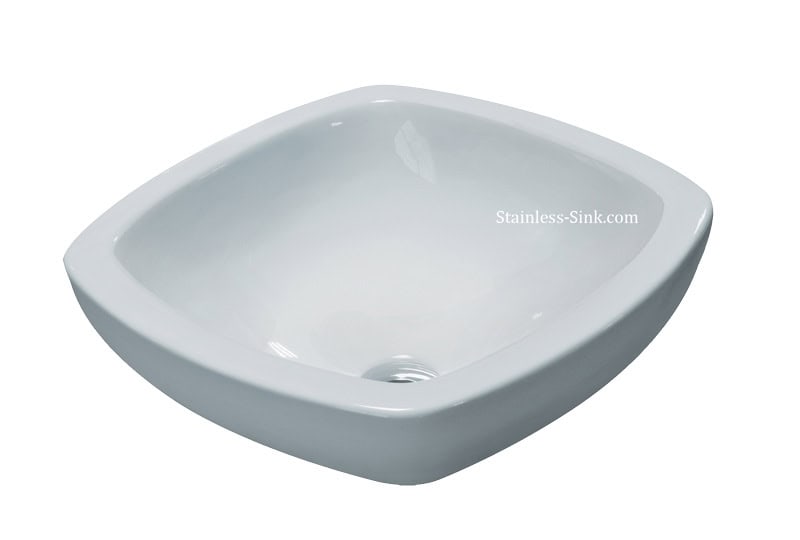 White square bathroom sink with smooth finish and drain hole.