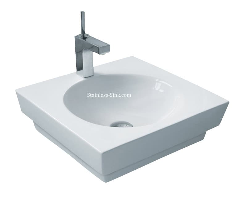 Contemporary white bathroom sink with chrome faucet for modern decor.