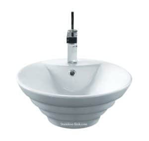 Contemporary stainless steel bathroom sink with faucet and drain.