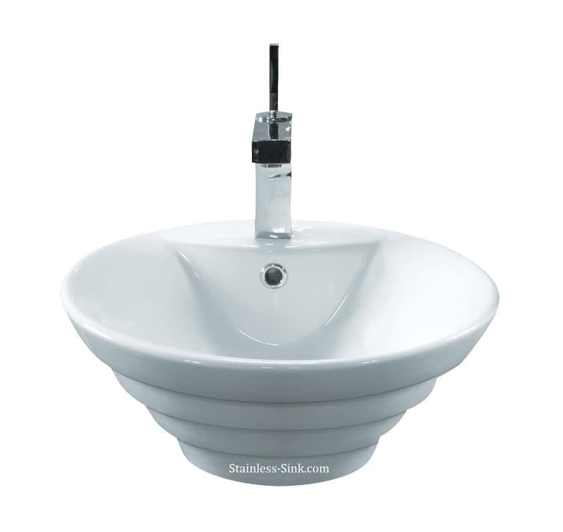 Contemporary stainless steel bathroom sink with faucet and drain.