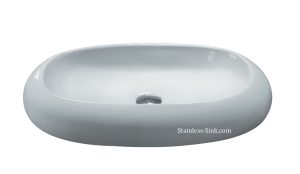White oval bathroom sink with smooth surface and drain hole.