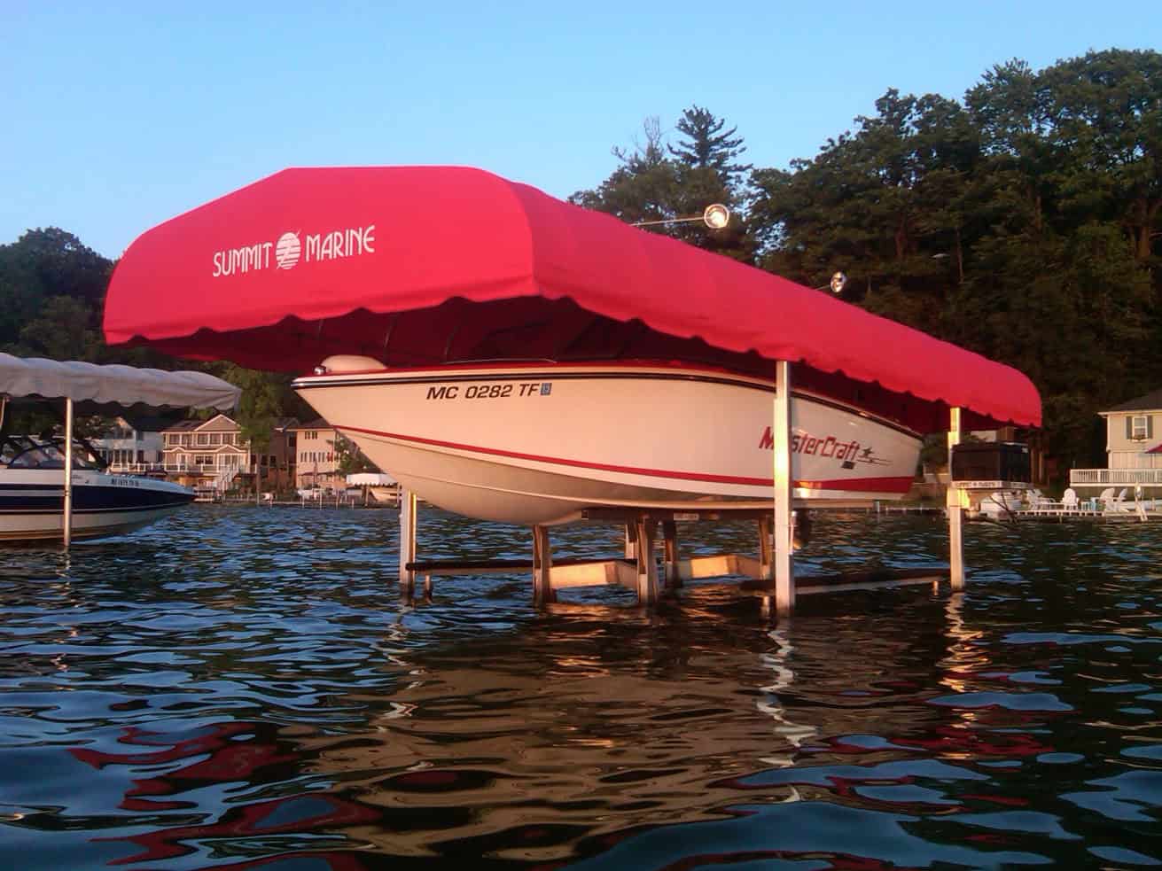 Custom boat cover by Summit Marine on a boat in the water.