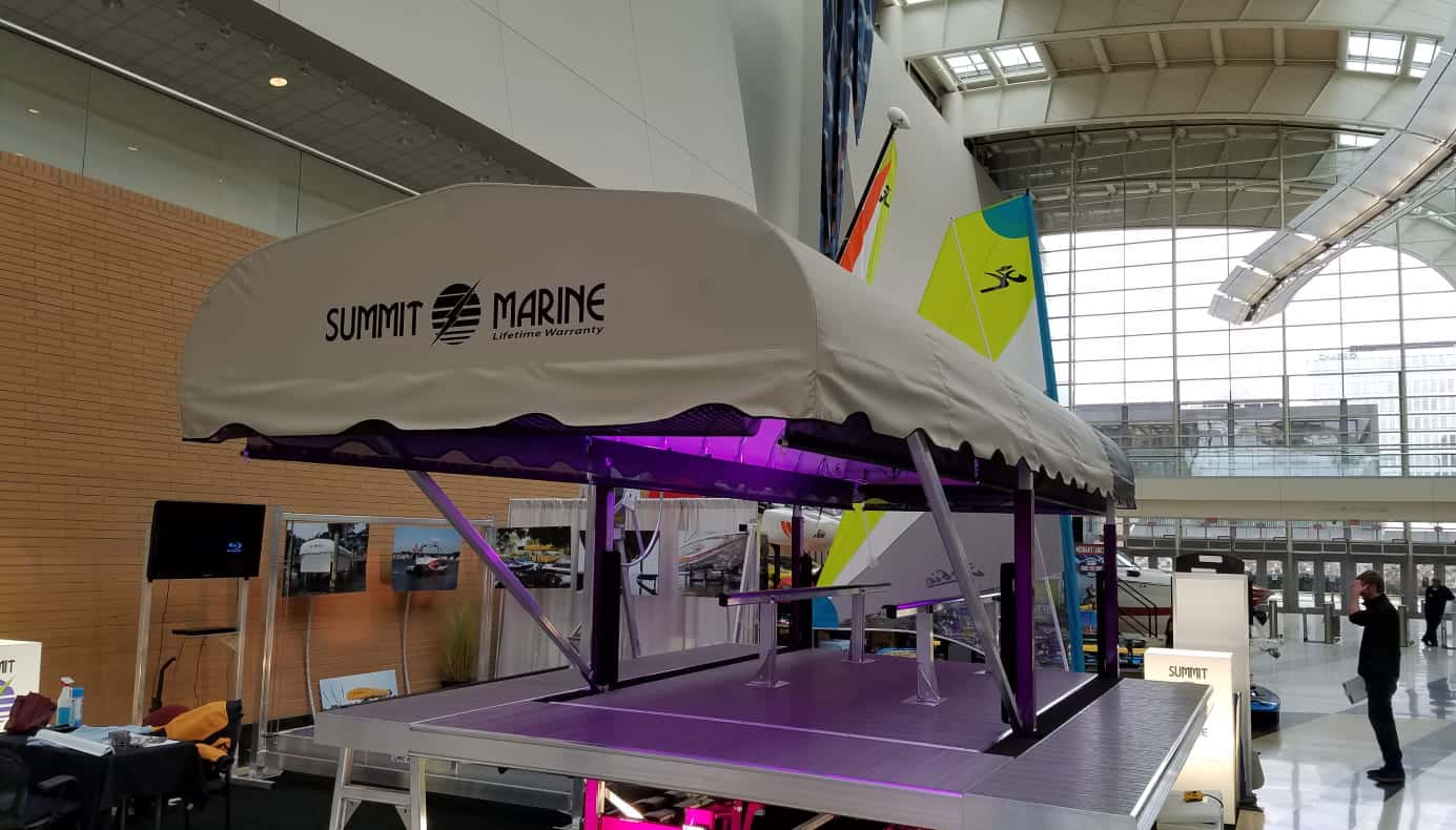 Custom boat cover by Summit Marine at an indoor boat show.