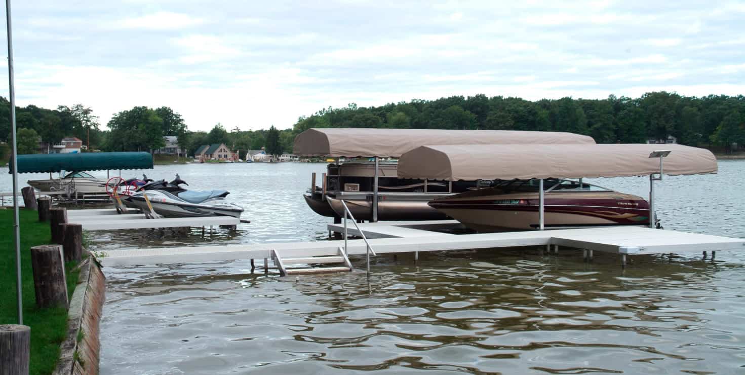 Boat dock with covered boats at Summit Marine.
